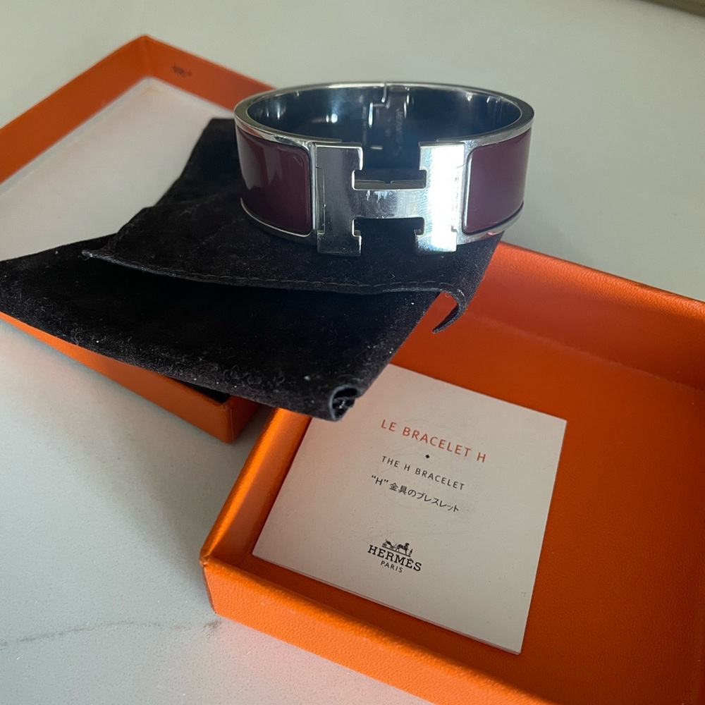 100% authentic Hermes clic clac H bangle. Comes with original box and pouch.